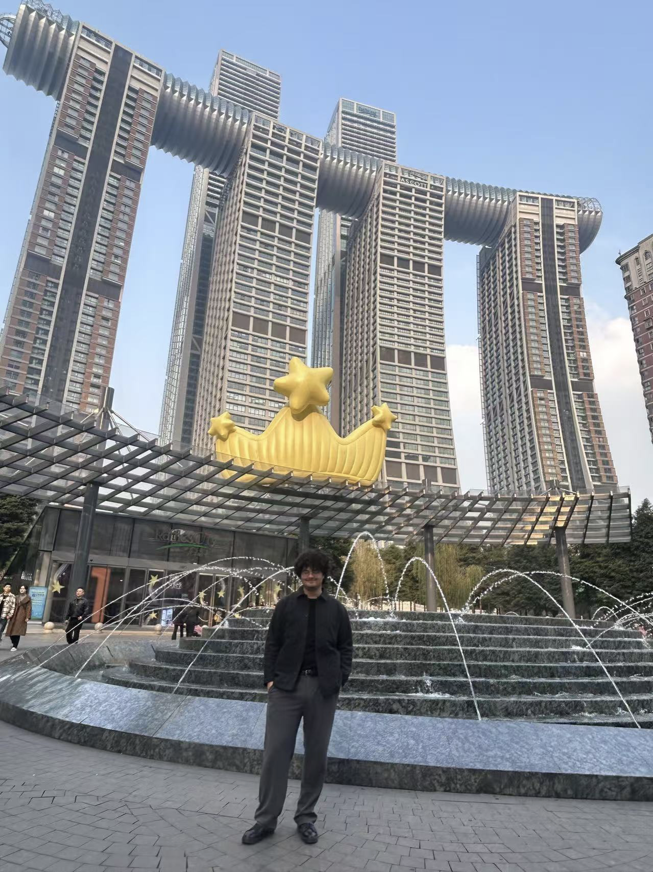 In Front of the famous connected three building